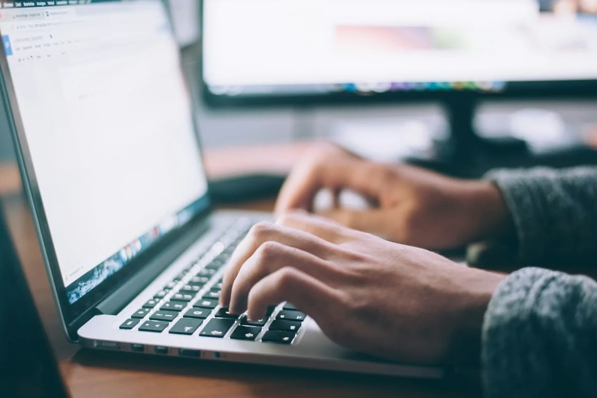 Event promoter reviewing AI-personalized email campaigns on their computer